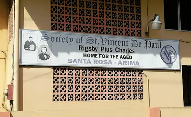 Entrance sign of the Rigsby Pius Charles Home for the Aged, Santa Rosa, Arima